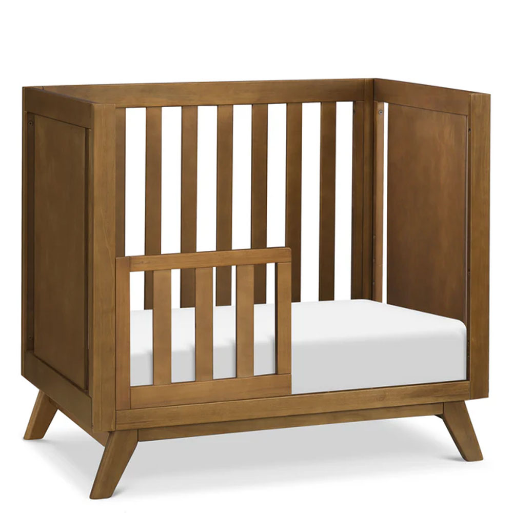 Otto mini crib with modern design and 4-inch mattress, available in Los Angeles.