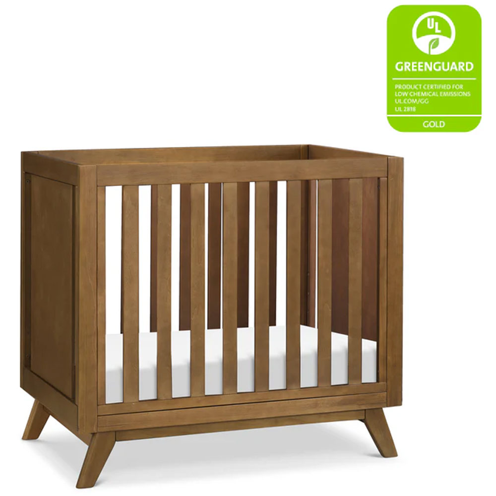 Space-saving Otto convertible crib with mattress for nurseries in Eagle Rock.
