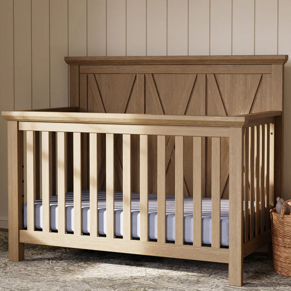 Close-up of textured driftwood finish on farmhouse-style convertible crib – eco-friendly baby furniture in Glendale & Pasadena.
