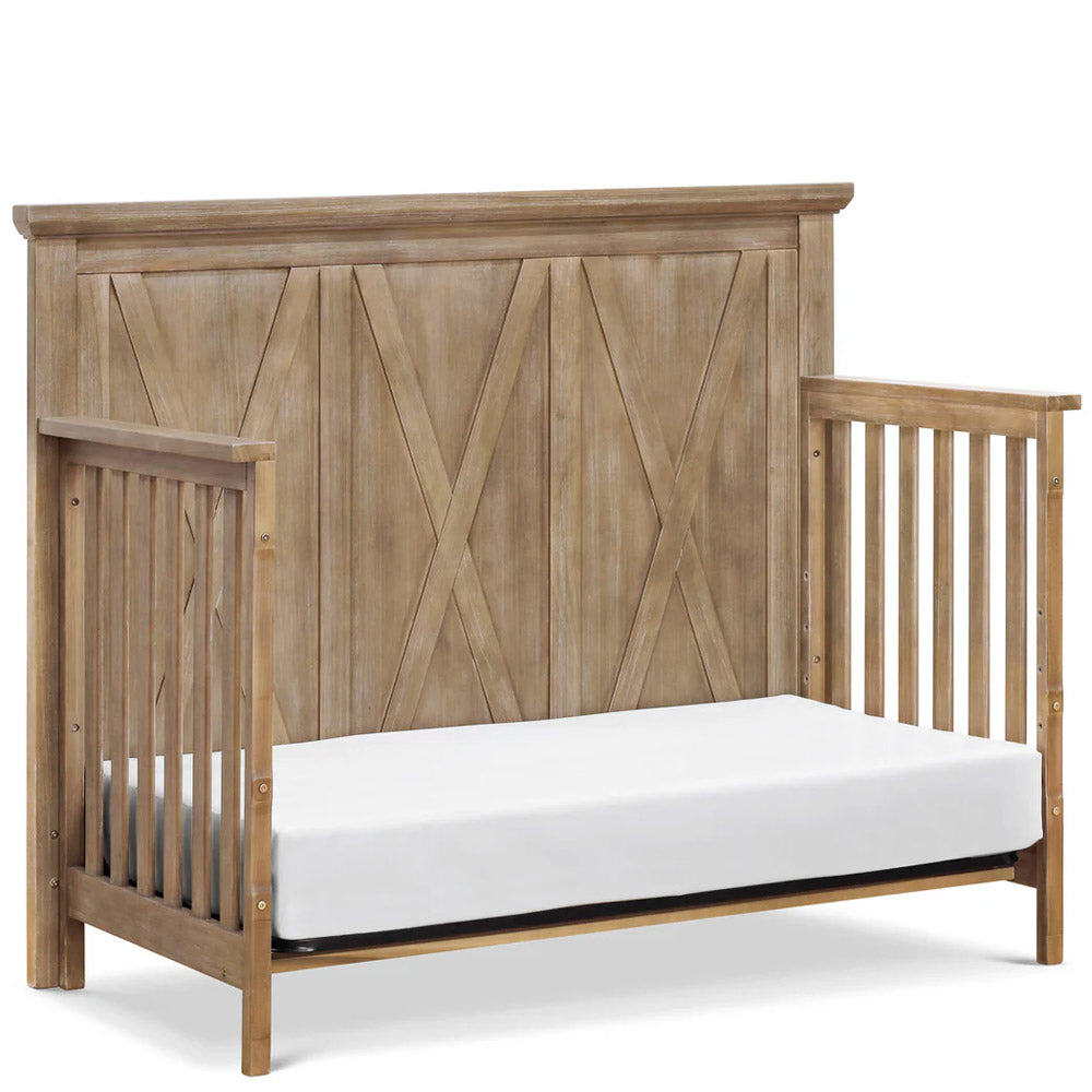 Side profile of rustic driftwood 4-in-1 convertible crib with farmhouse details – nursery furniture in Los Angeles, Eagle Rock.