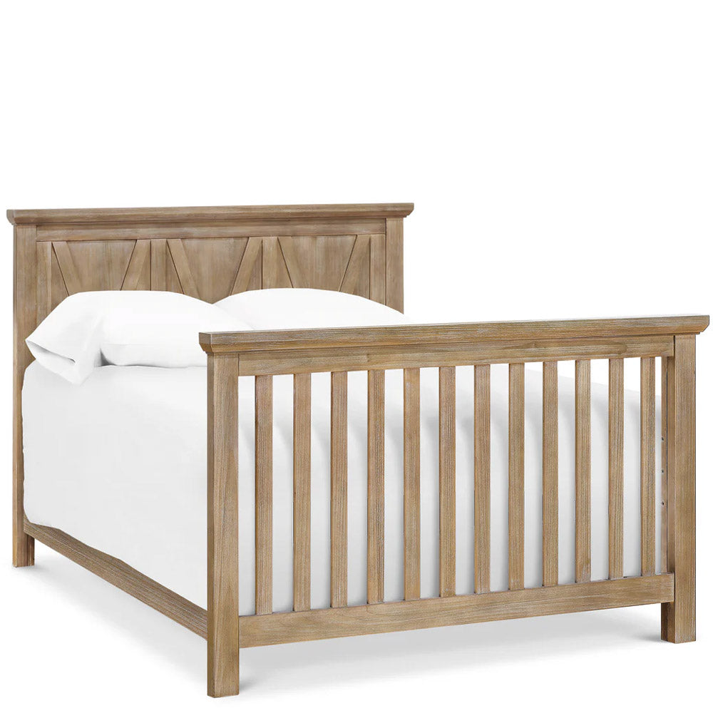 Detail: “Textured driftwood finish and carved X-brace headboard on convertible crib – Eagle Rock showroom.