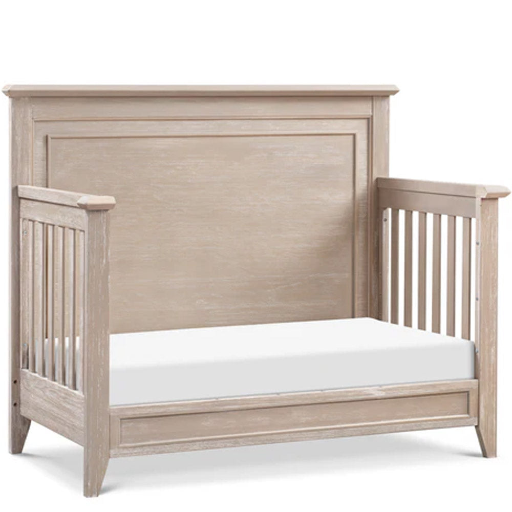 Close-up of sandbar finish headboard on Beckett rustic convertible crib, crafted for style and durability in Los Angeles nurseries