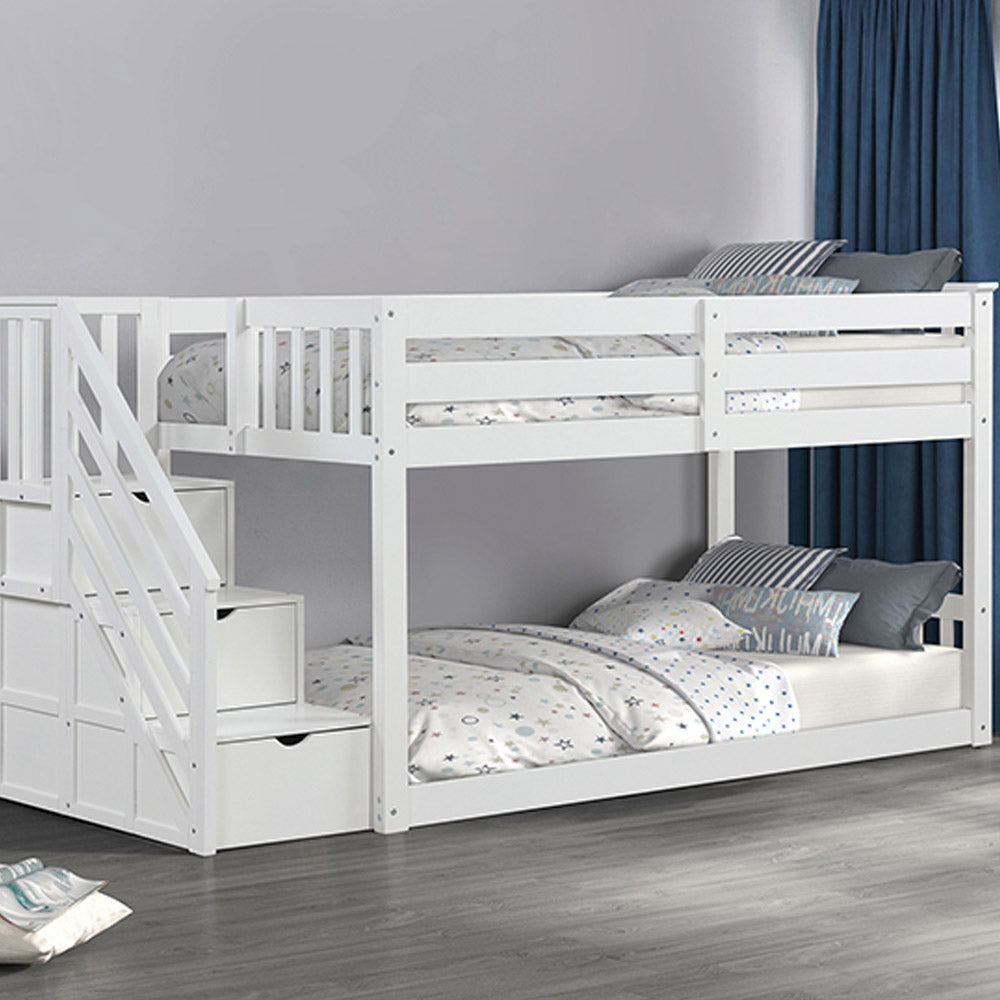 Low twin bunk bed in white with storage drawers in staircase in Los Angeles