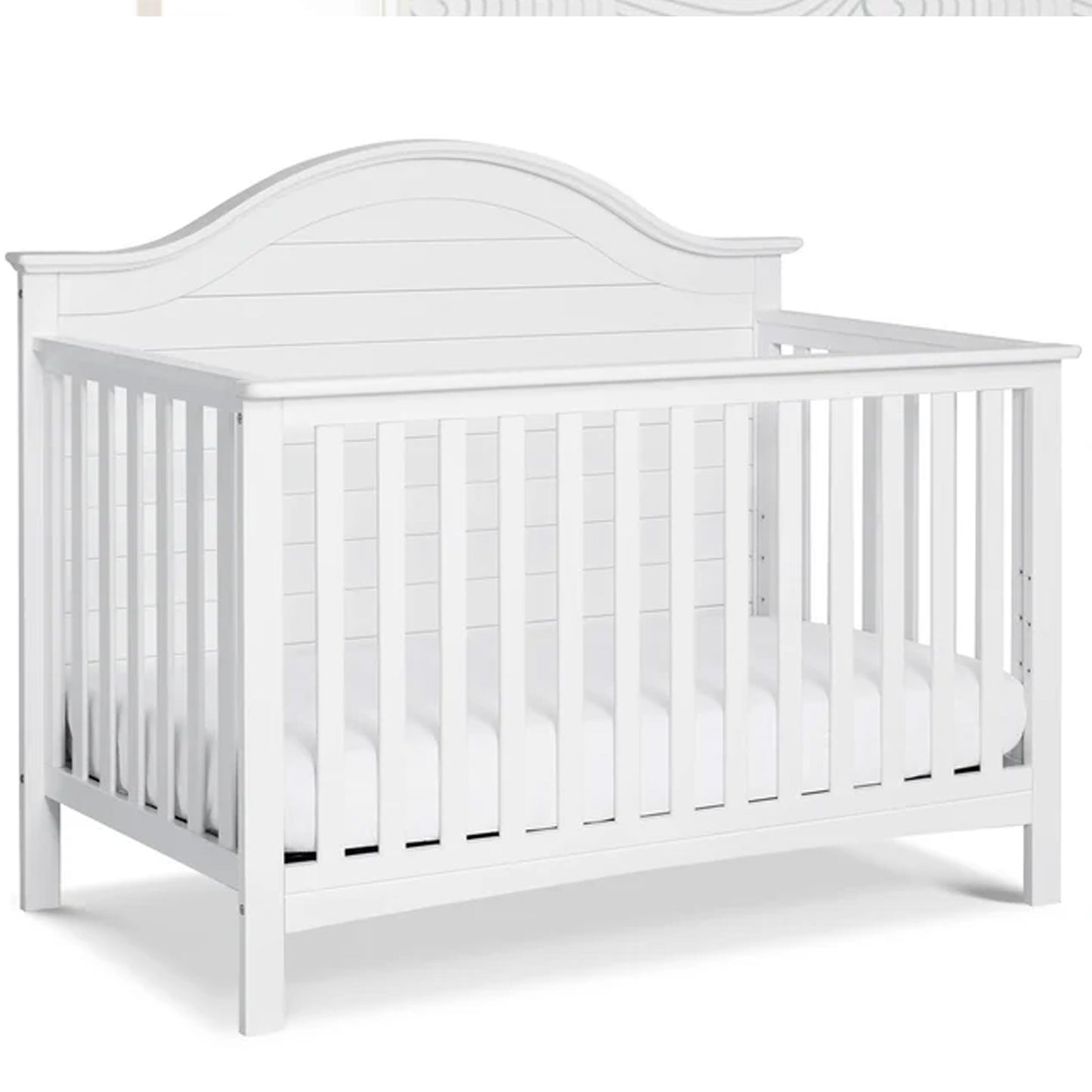 Premium farmhouse-inspired Nolan crib with curved-top molding designed for timeless nursery appeal