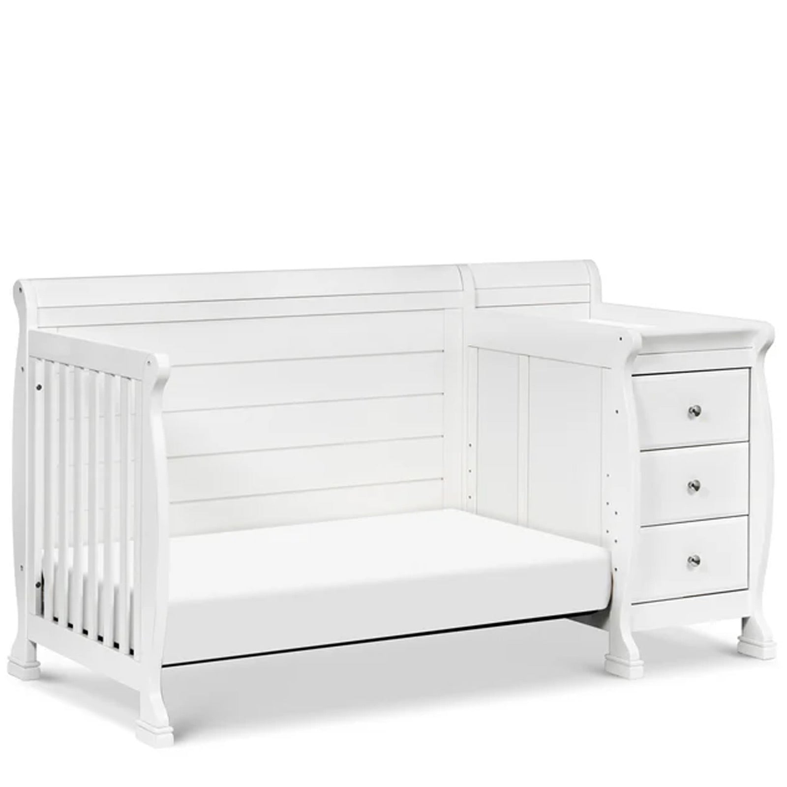 Modern white baby crib with changing station featuring adjustable mattress heights and four-stage bed conversion.