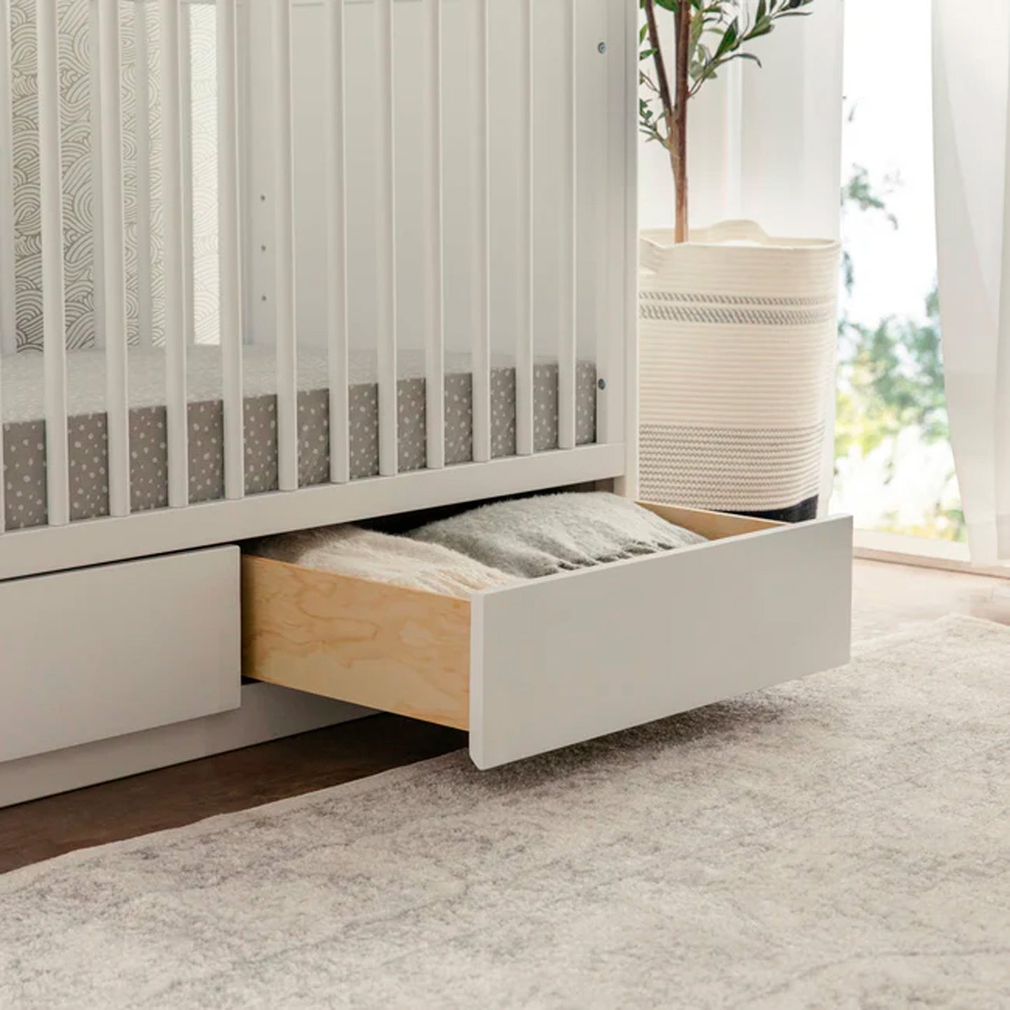 Close-up of the Bento crib craftsmanship and wood finish