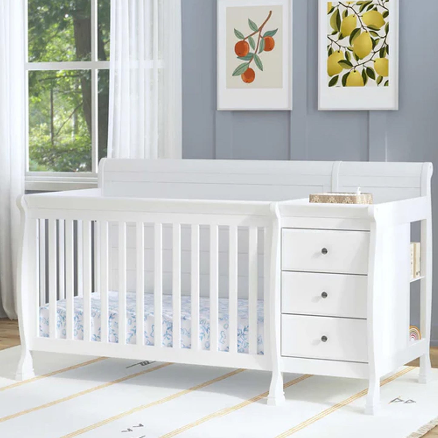 White convertible baby crib with built-in changing station demonstrating four growing stages from nursery to full-size bed.
