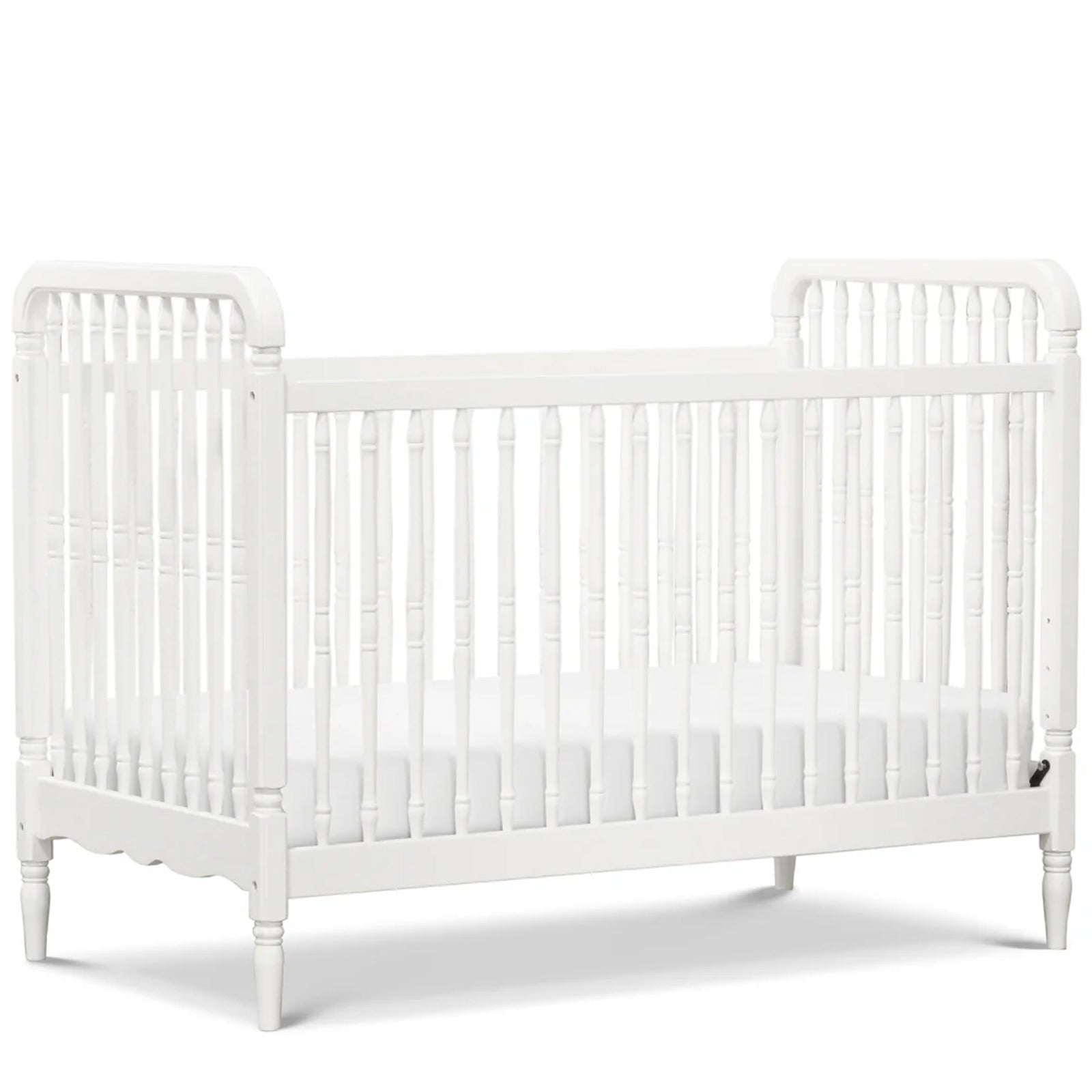 Elegant solid wood spindle crib with included toddler bed conversion kit for lasting value