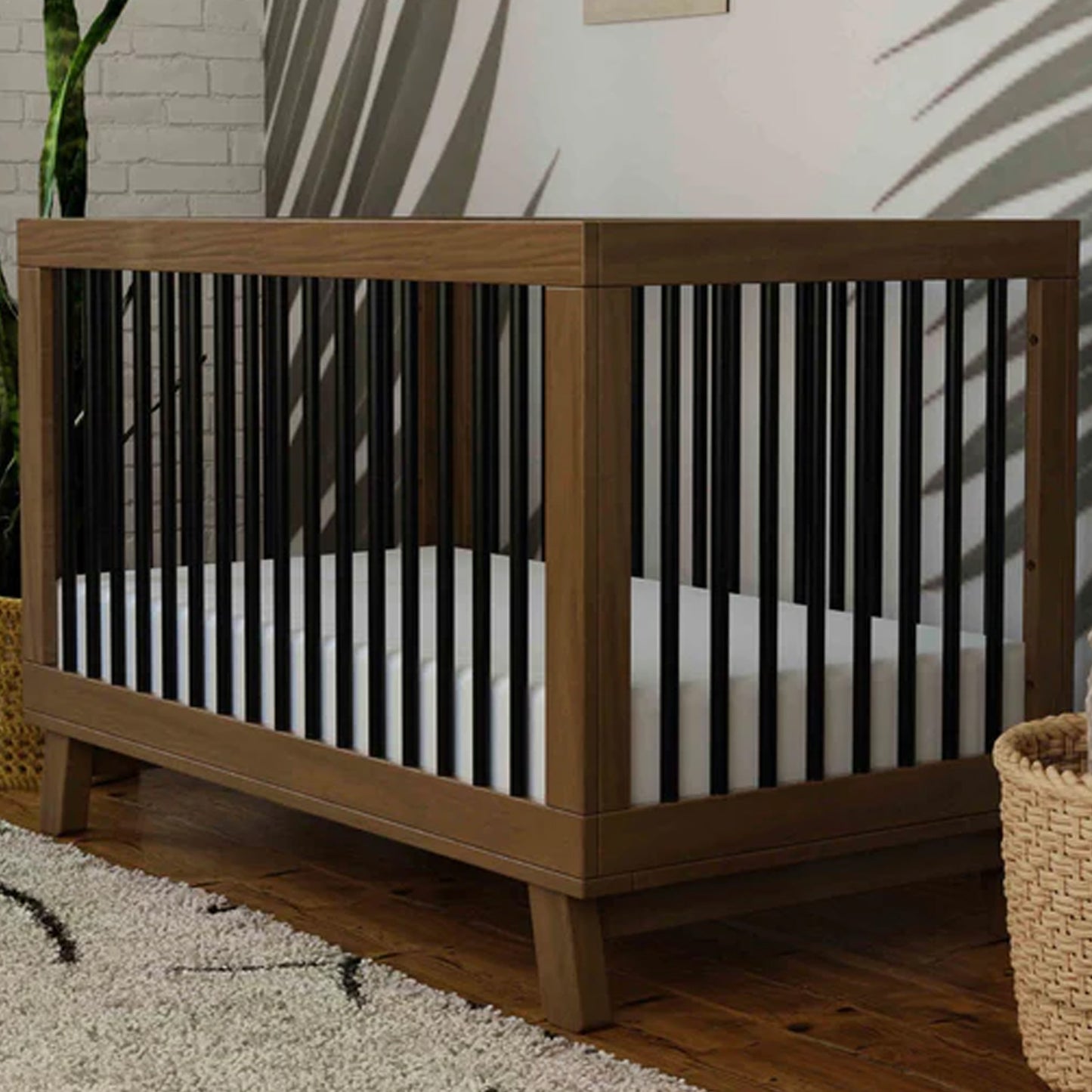 Hudson 3-in-1 convertible crib in Natural Walnut and Black with included toddler bed conversion kit available at Kids Furniture Superstore in Los Angeles