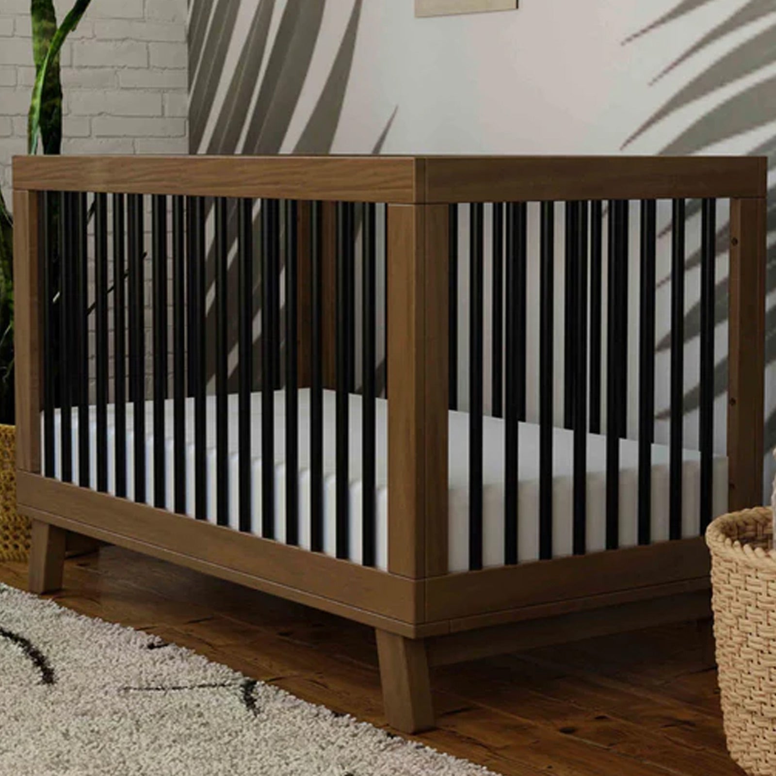 Hudson 3-in-1 convertible crib in Natural Walnut and Black with included toddler bed conversion kit available at Kids Furniture Superstore in Los Angeles