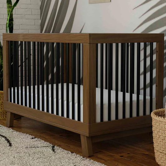 Hudson 3-in-1 convertible crib in Natural Walnut and Black with included toddler bed conversion kit available at Kids Furniture Superstore in Los Angeles