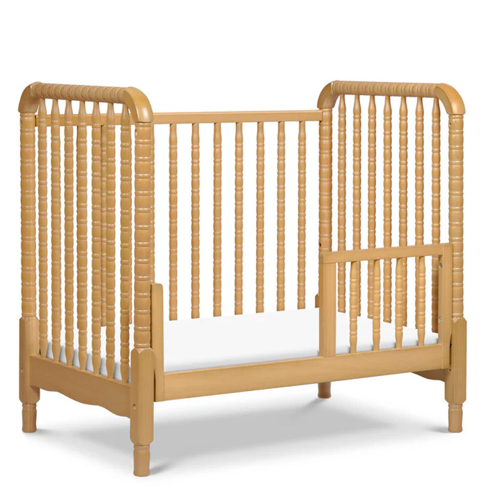Honey finish Jenny Lind baby crib perfect for compact nursery spaces in Los Angeles