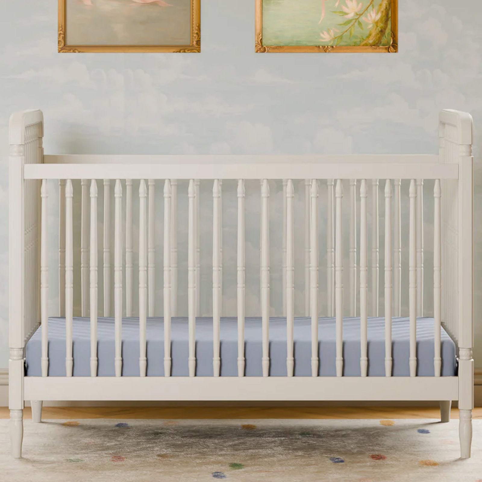 Liberty 3-in-1 convertible spindle crib with included toddler bed conversion kit available at Kids Furniture Superstore in Los Angeles