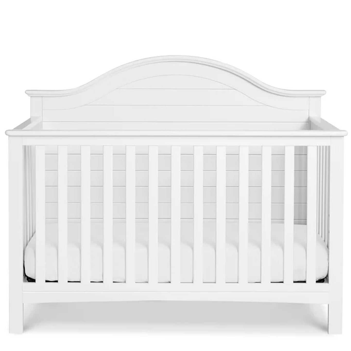 Elegant nursery crib with a shiplap-style planked headboard for a warm and inviting baby room