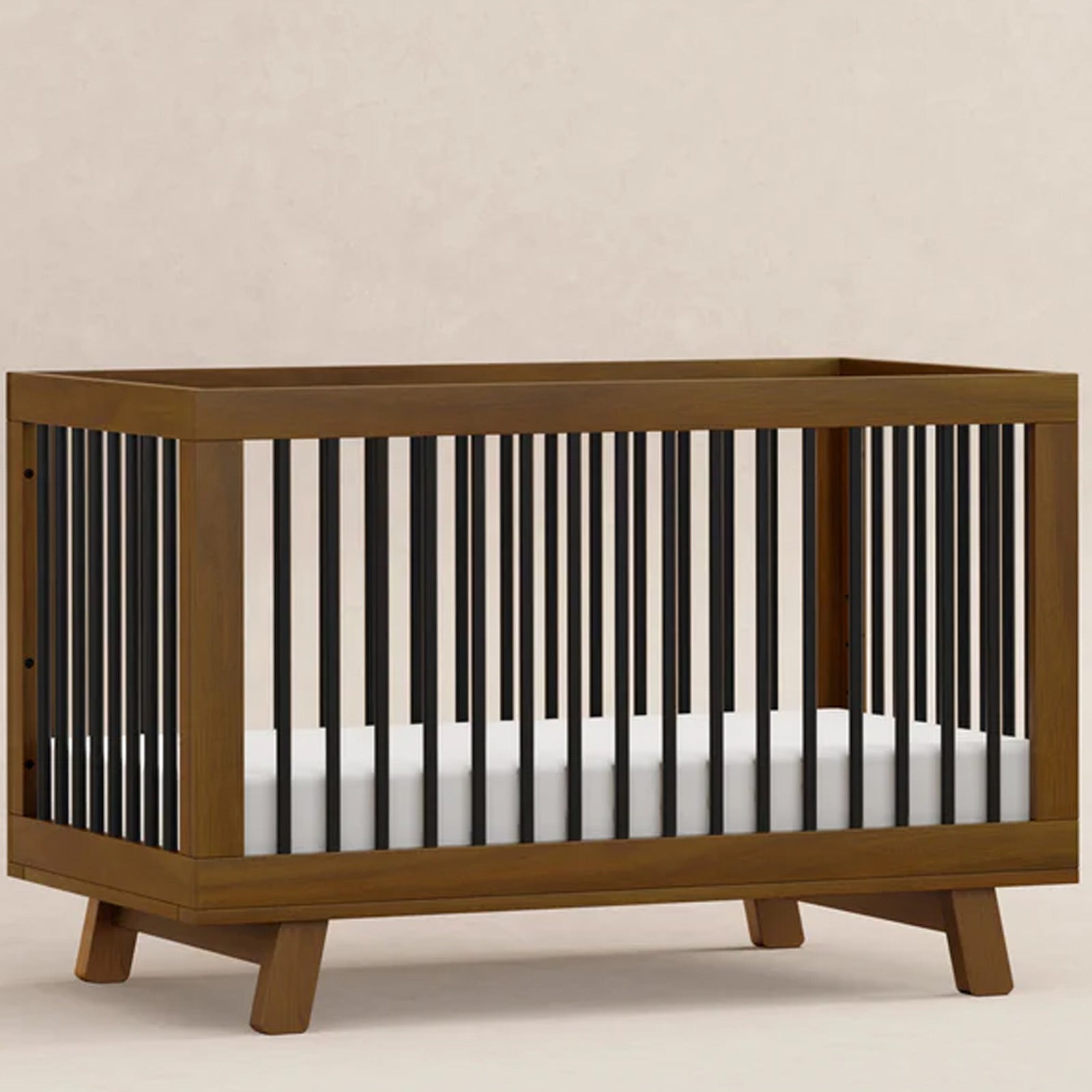 Premium Hudson convertible crib featuring a Natural Walnut and Black finish for modern nurseries in Southern California.