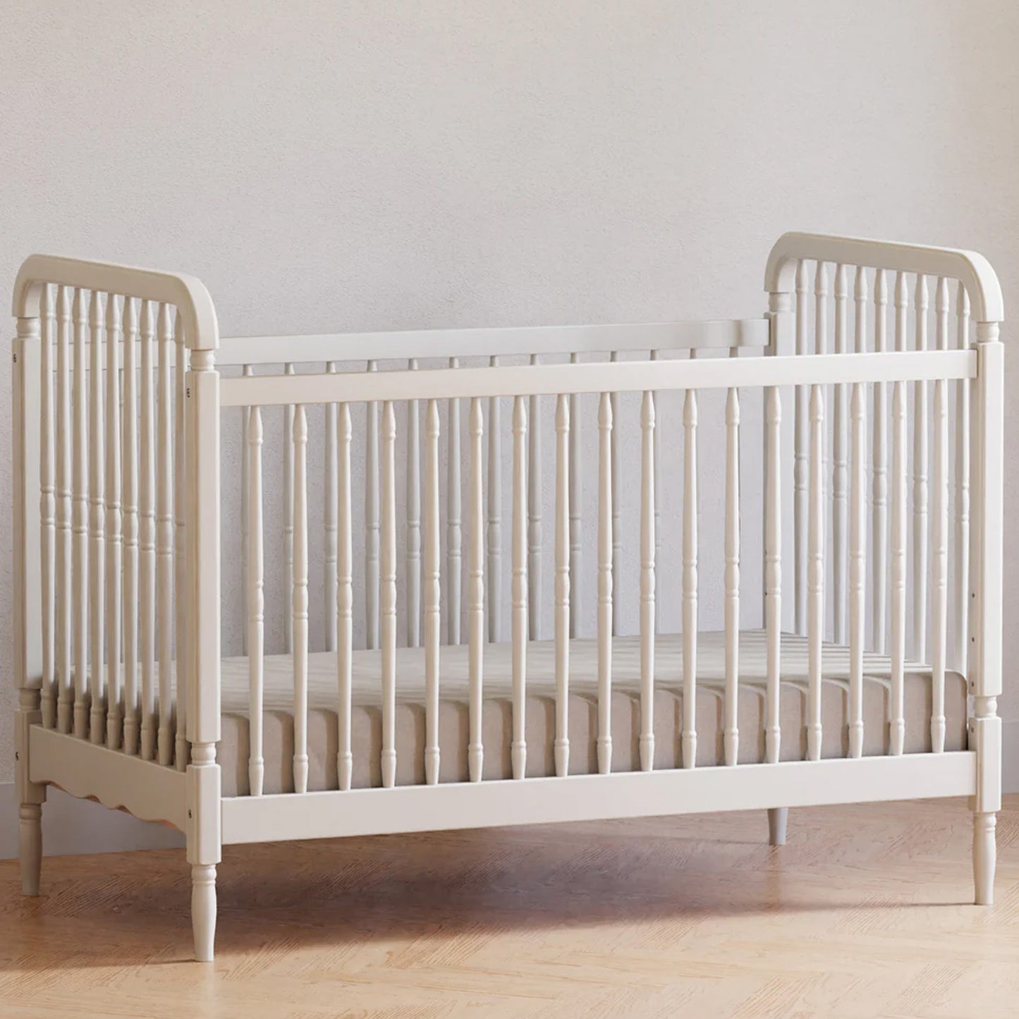 Premium Liberty spindle crib designed to convert from a crib to a toddler bed and daybed for growing families